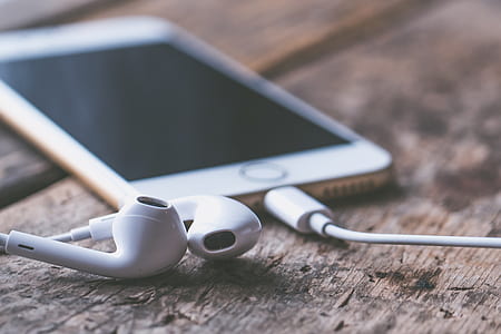 bokeh photography of Apple EarPods thumbnail