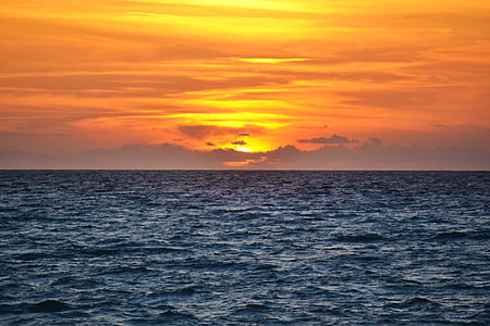 body of water during sunset thumbnail