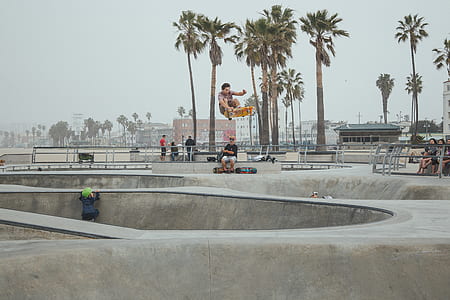 man skating in skate park during daytime thumbnail