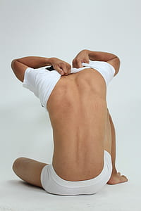 person removing shirt while sitting down thumbnail