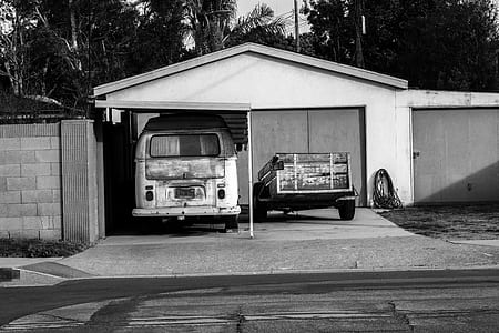 grayscale photography of vehicle park on garrage thumbnail