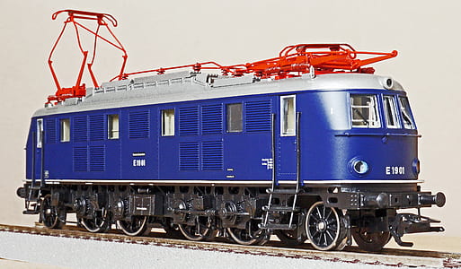 blue and white train on rail thumbnail