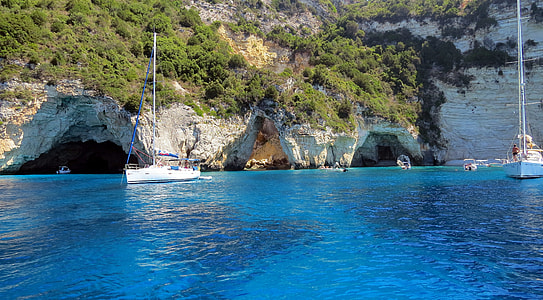 two white boats floating on body water thumbnail