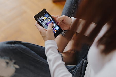 Beautiful young woman using smartphone thumbnail