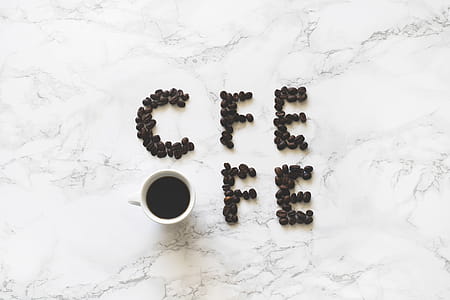 Coffee Beans and White Ceramic Mug With Black Liquid thumbnail