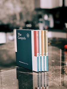shallow focus photography of The Gospels book collection thumbnail
