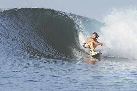 man playing surf during daytime thumbnail