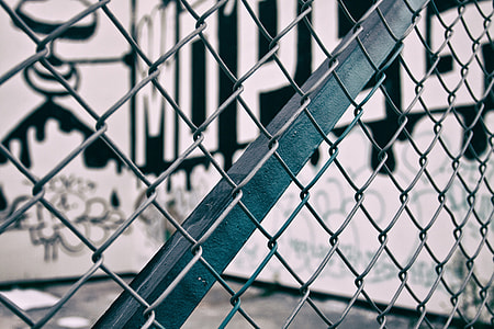 Close-up shot through a urban metal fence thumbnail