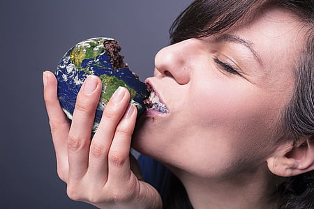woman eating chocolate globe pastry thumbnail