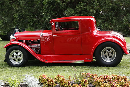 red vehicle on grassfield thumbnail