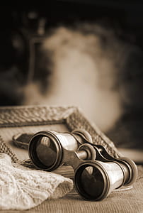 gray binoculars on gray surface thumbnail