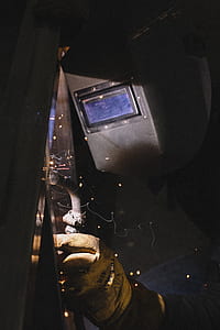 man welding metal during daytime thumbnail