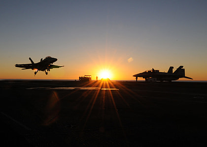 Fighter jets landing at sunset thumbnail