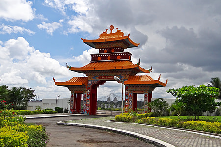photo of orange and red gateway under cloudy sky thumbnail