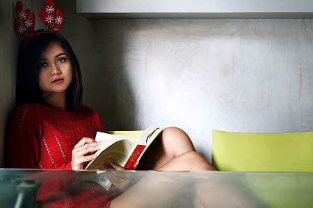 Photo of a Woman in Red Dress Holding a Book thumbnail