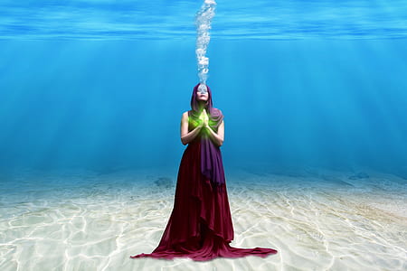 woman earing red sleeveless maxi dress in body of water thumbnail