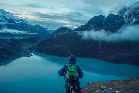 person standing in front of river thumbnail