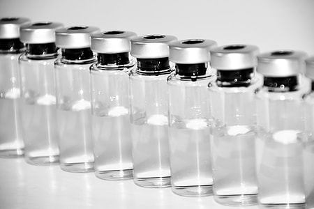clear glass vial lot on white surface thumbnail