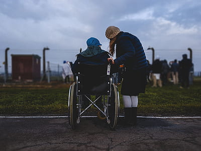 person on wheelchair in front of grass thumbnail
