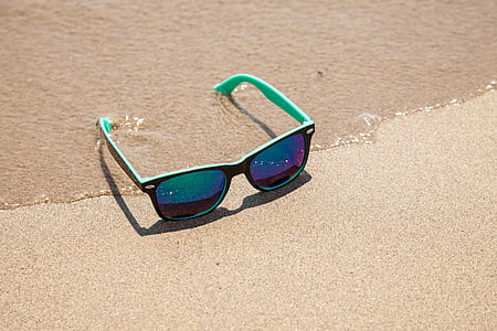black framed Justin sunglasses on sand thumbnail