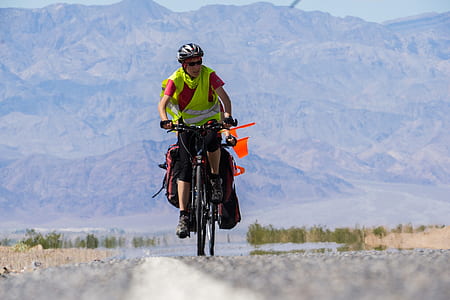 man riding bicycle on road thumbnail