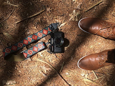 black DSLR camera on floor thumbnail