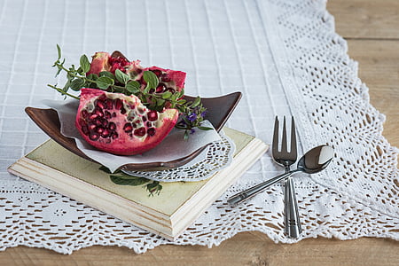 sliced pomegranate on curvy plate thumbnail