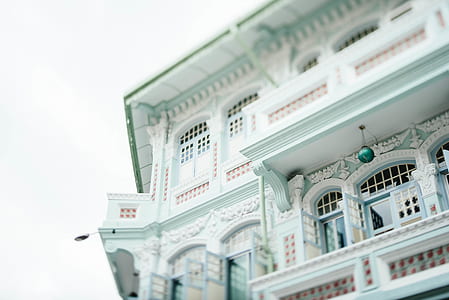 worm's eye-view photo of white concrete mansion thumbnail