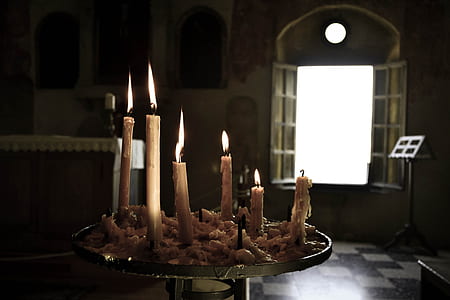 lit candle near window thumbnail