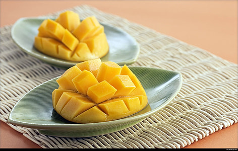 two slices of mangoes on bowls thumbnail