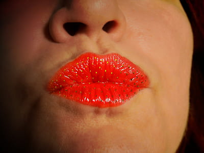 woman pouting lips wearing red strawberry lipstick thumbnail