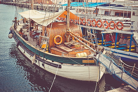 white and green boat during daytime thumbnail