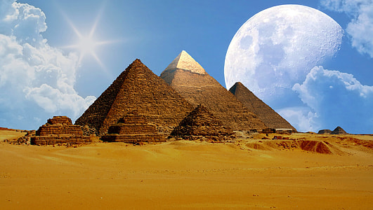 brown pyramids under white cloudy sky thumbnail