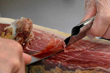 person slicing meat thumbnail