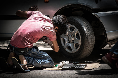 photo of man repairing the car thumbnail