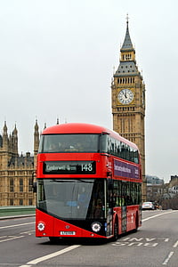 red and black double-decker bus passing by Winchester Palace thumbnail