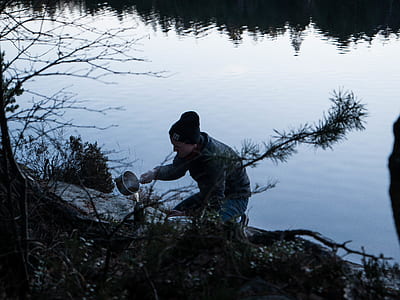 man pouting water in container thumbnail