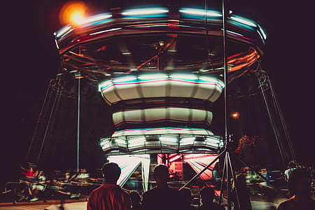 Silhouette Photography of People in Front of a Circus Ride thumbnail