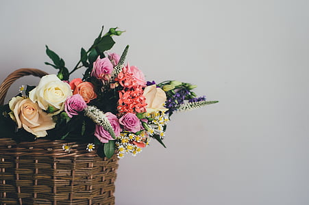 white, pink, and red roses in wicker basket thumbnail