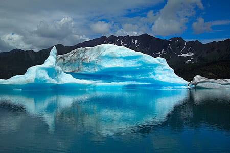 Scenic View of Frozen Lake Against Blue Sky thumbnail