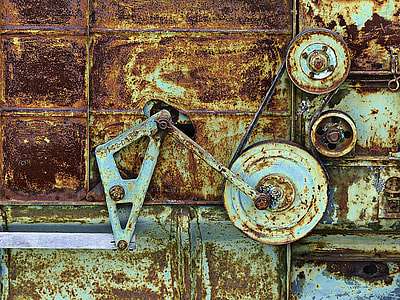 rusted gray metal tool on brown wooden table thumbnail