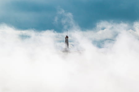 lighthouse near cloud during daytime thumbnail