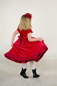 girl wearing red dress and holding her dress thumbnail