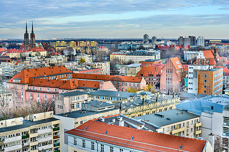 aerial photography of buildings under blue and white cloudy sky during daytime thumbnail