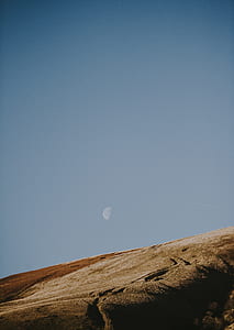 brown hill under blue sky thumbnail