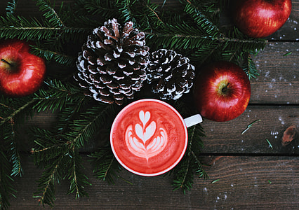 three red apples on brown wooden surface thumbnail