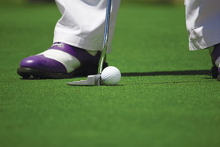 person wearing purple-and-white shoes while playing golf thumbnail