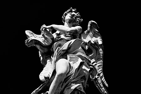 High-contrast monochrome shot of a statue on the River Tiber in Rome, Italy thumbnail