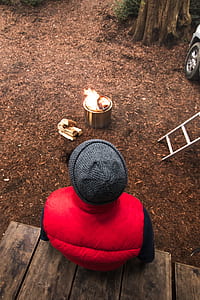 person sitting on wooden planks thumbnail