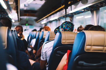 people in bus in tilt shift lens photography thumbnail